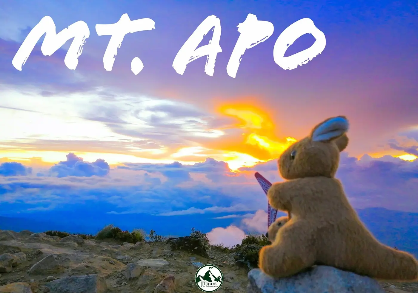 Plush toy watching the sunset above the clouds on Mt. Apo
